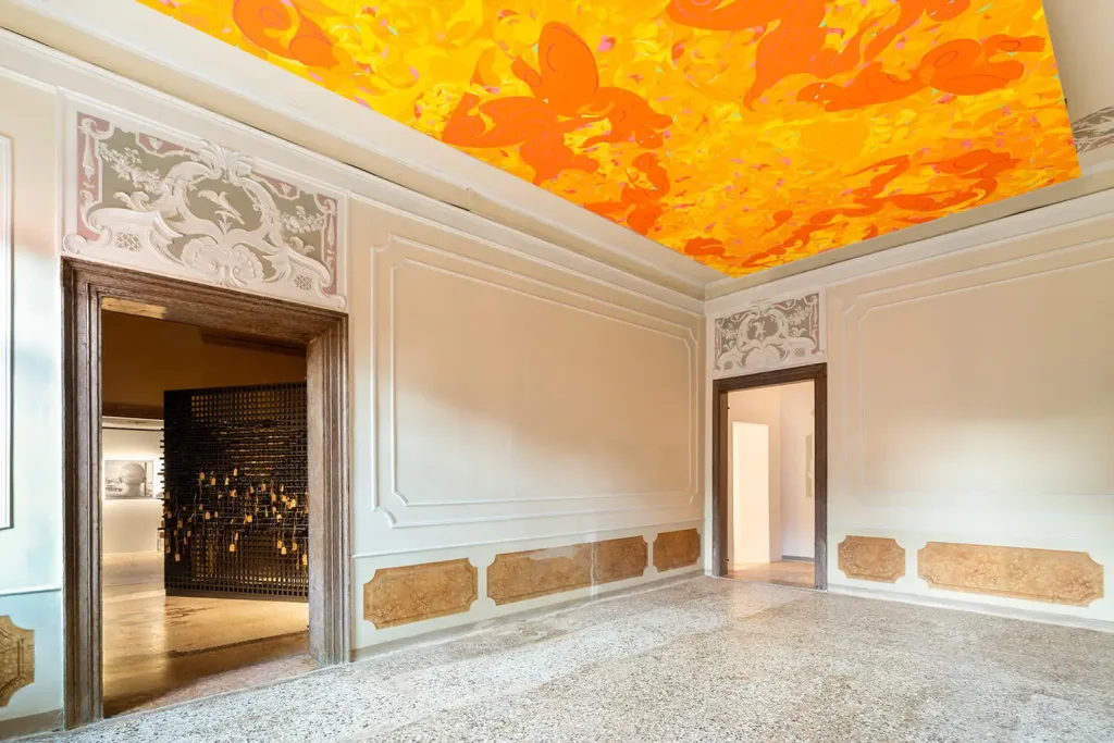 A room featuring a ceiling adorned with an intricate orange design